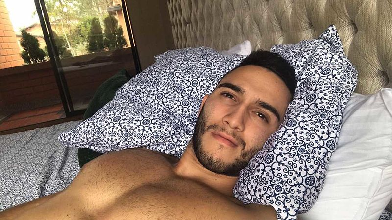 handsome cam hunk in bed preparing for live chat cum solo
