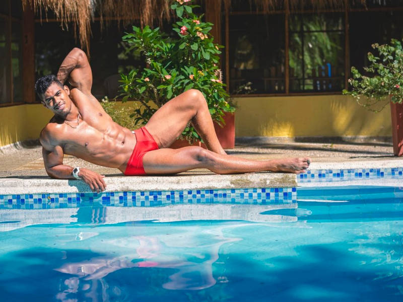 Tiago De Sousa lounging poolside on male web cams